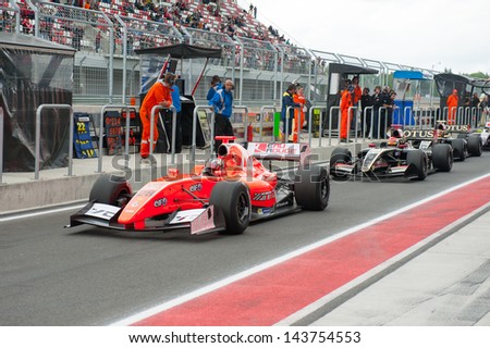 MOSCOW - JUNE 23: Formula cars ready for start at pit lane at World Series by Renault in Moscow Raceway on June 23, 2013 in Moscow