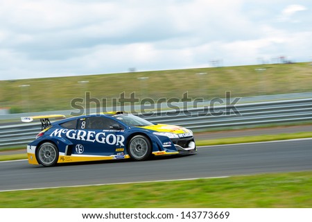 MOSCOW - JUNE 23: Jeroen Schothorst of TDS Racing team race at Megane Trophy V6 race at World Series by Renault in Moscow Raceway on June 23, 2013 in Moscow