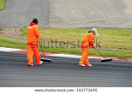 MOSCOW - JUNE 23: Staff cleans the track at World Series by Renault in Moscow Raceway on June 23, 2013 in Moscow