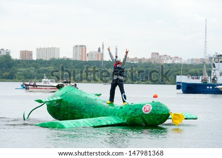 MOSCOW - JULY 28: Competitors perform a show on Red Bull Flugtag on July 28, 2013 in Moscow. Red Bull Flugtag is an event in which competitors attempt to fly homemade human-powered flying machines