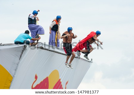 MOSCOW - JULY 28: Competitors jump to water on Red Bull Flugtag on July 28, 2013 in Moscow. Red Bull Flugtag is an event in which competitors attempt to fly homemade human-powered flying machines