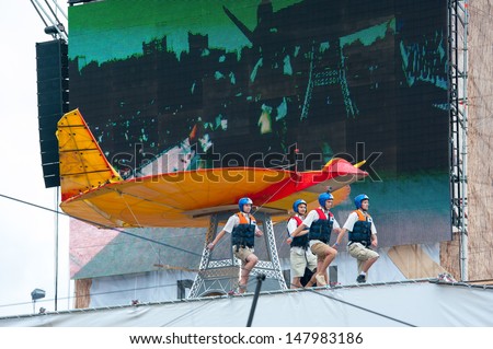MOSCOW - JULY 28: Competitors perform a show on Red Bull Flugtag on July 28, 2013 in Moscow. Red Bull Flugtag is an event in which competitors attempt to fly homemade human-powered flying machines