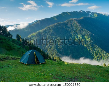 Tent in the hikers camp in mountains