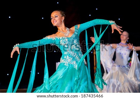 Female dancer performs at dance championship. Slow waltz dance.
