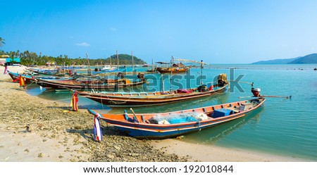 SAMUI, THAILAND - MARCH 27: Fishing boats moored at the shore on March 27, 2014 in Samui, Thailand. Fishing is one of the main activities of the locals in Thailand