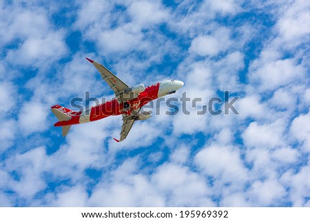 PHUKET - APRIL 6: AirAsia plane takes off from Phuket on April 6, 2014 in Thailand. It is largest low cost airline in Asia. Local and international flights to over 400 destinations in 25 countries