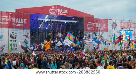 BIG ZAVIDOVO, RUSSIA - JULY 4: People attend open-air rock festival \