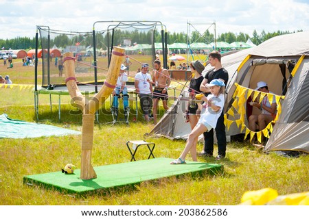 BIG ZAVIDOVO, RUSSIA - JULY 4: People attend open-air rock festival \