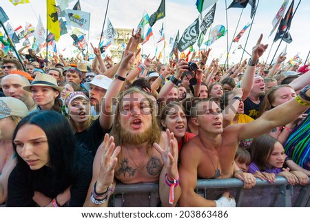 BIG ZAVIDOVO, RUSSIA - JULY 4: People cheering at open-air rock festival 