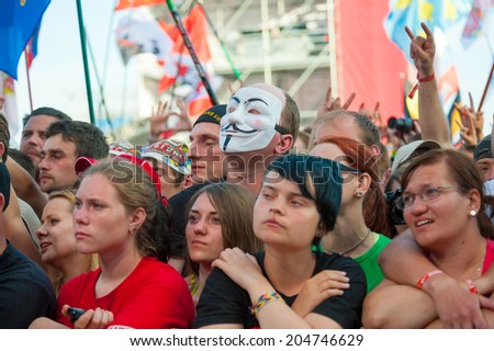 BIG ZAVIDOVO, RUSSIA - JULY 5: People cheering at open-air rock festival \
