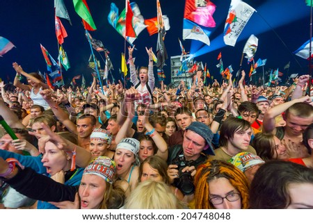 BIG ZAVIDOVO, RUSSIA - JULY 5: People cheering at open-air rock festival 