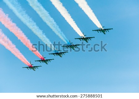 MOSCOW - MAY 7: Fighters do smoke in colors of Russian flag at last rehearsal of the parade dedicated to 70th anniversary of the victory in the Second World War in Red Square on May 7, 2015 in Moscow