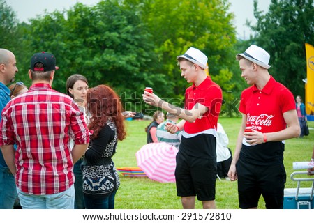 MOSCOW - JUNE 20, 2015: Promoters handing out free cans of Coca-Cola Zero on XII International Jazz Festival \
