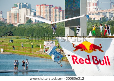MOSCOW - JULY 26: Competitors perform a flight on Red Bull Flugtag on July 26, 2015 in Moscow. Red Bull Flugtag is an event in which competitors attempt to fly homemade human-powered flying machines