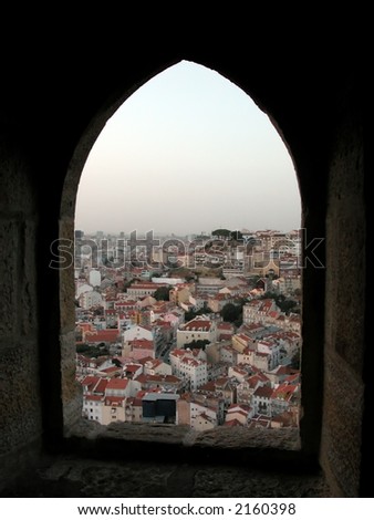 View to the tile roofs in the old Lisbon centre Alfama through the loop-hole.