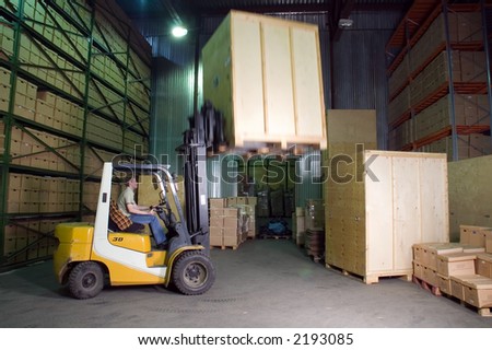 Man working on the truck in the warehouse