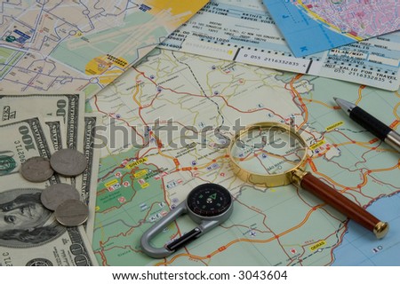 Objects for planning travel - a map, compass, a magnifier, money