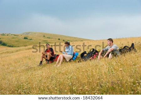 Hikers have a rest on a hillside