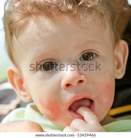Portrait of baby with finger in mouth