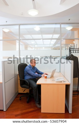 An employee in the office doing his boring job