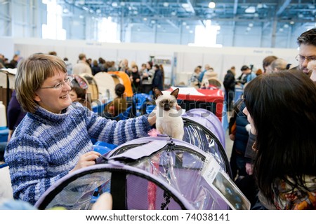 MOSCOW - MARCH 6: Unidentified member of the exhibition shows his cat at international exhibition of cats \