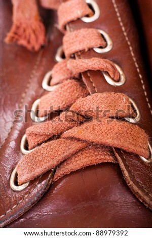 Laces of brown shoes close up