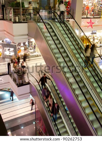 People in the multilevel mall, motion blurred