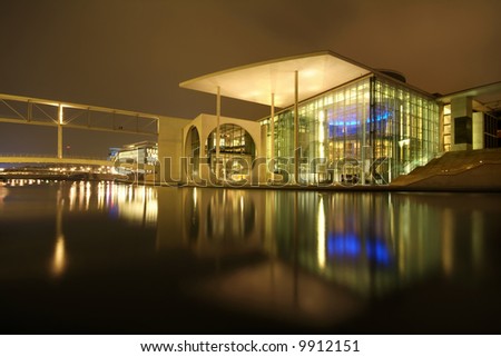 modern architecture reflecting in water
