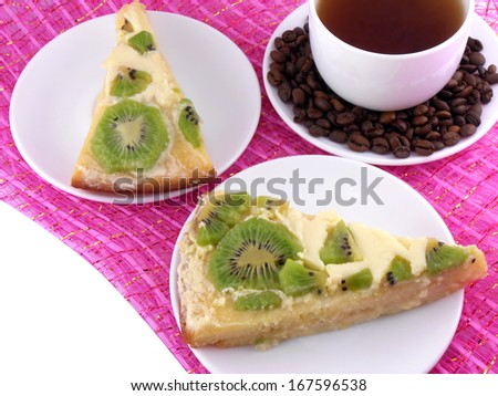 Coffee cup and slice of kiwi tart