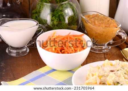 fresh carrots with salad and milk