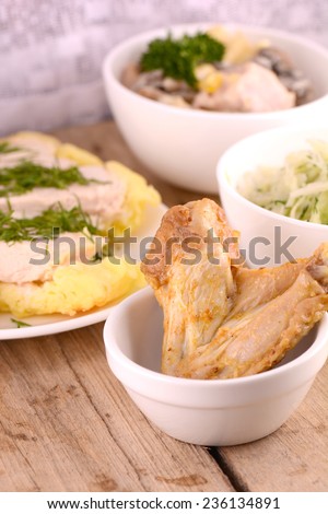 fresh chicken leg and chicken chop on wooden background