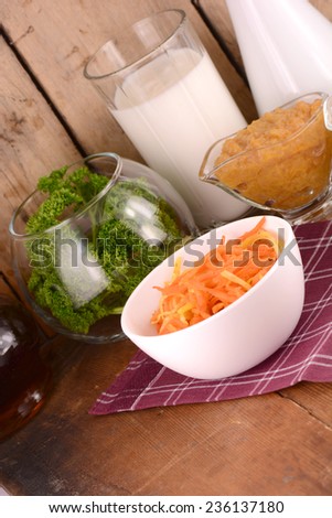 carrots on white plate with milk and parsley