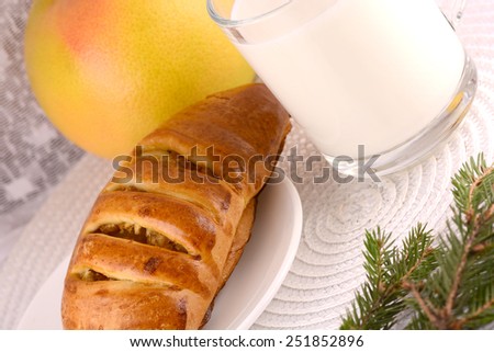 sweet cake on white plate and fruits with milk
