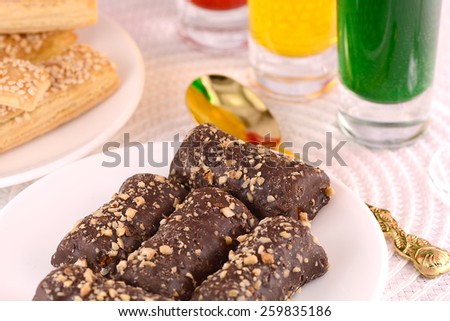 chocolate sweet cake on white plate and juice
