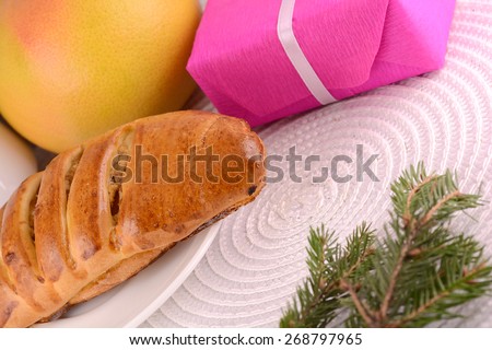 sweet cake on white plate, fruits and red gift box