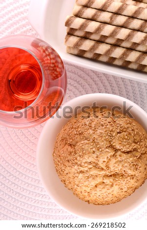 chocolate sweet cake and cookies on white plate and red wine