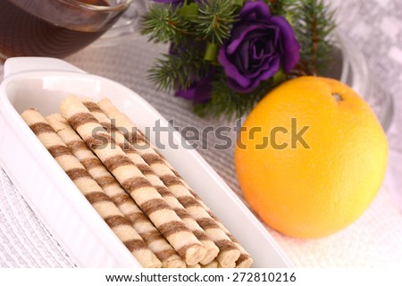 sweet cake on white plate, flowers and fruits