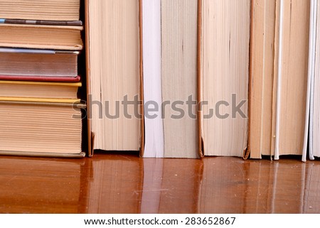 Old books leaning against each other for sale