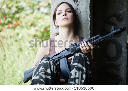 Young woman with rifle (Kalashnikov AK-74)
