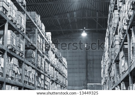 Industrial warehouse with plenty of boxes. Black and white photo