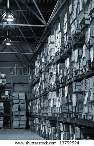 Industrial warehouse with plenty of boxes. Black and white photo