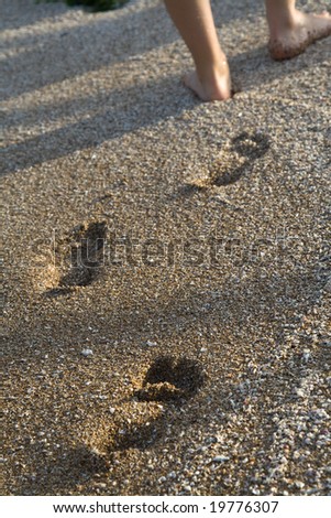 Woman walking on the sand