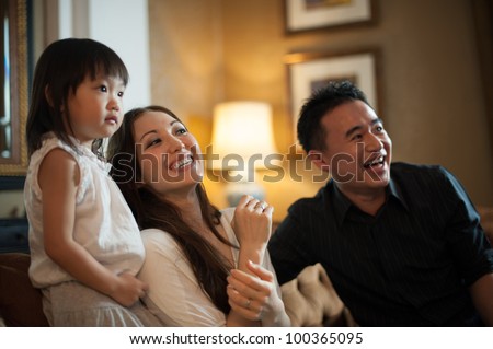 Attractive Asian Family in Lounge Area