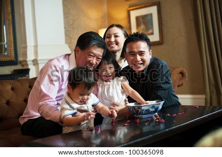 Attractive Asian Family in Lounge