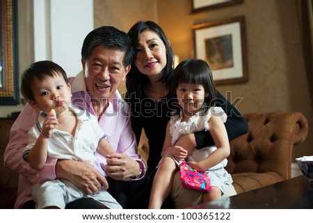 Attractive Asian Grand parents in Lounge