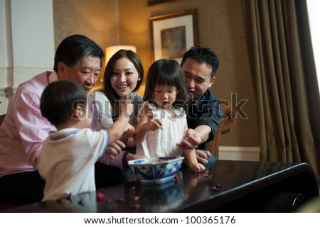 Attractive Asian Family in Lounge