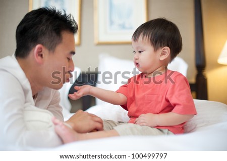 Asian dad with son