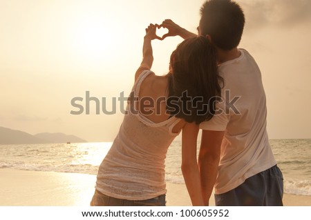 Attractive Young Couple On The Beach