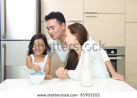 Happy Asian Family having breakfast together in the morning