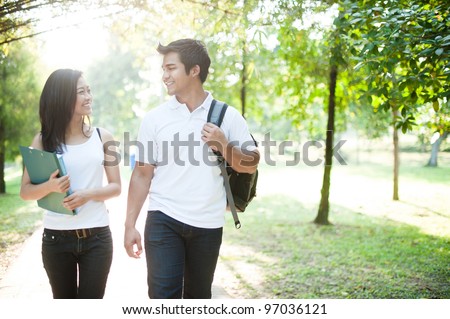 Attractive asian couple spending time together in the park